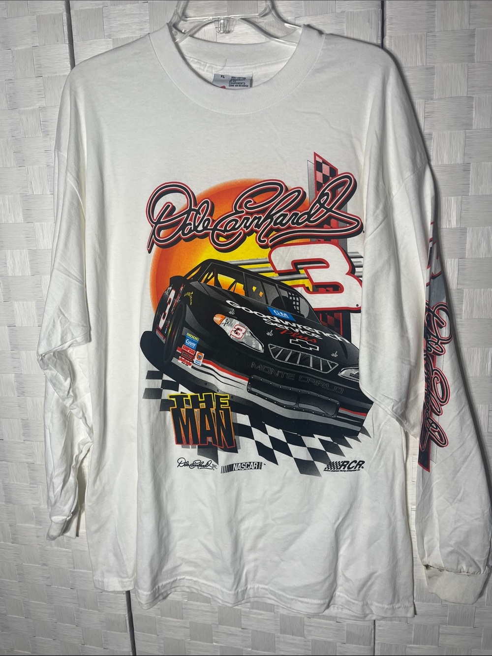 White Long-Sleeve Racing Graphic Tee with Bold Car Print stain on sleeve